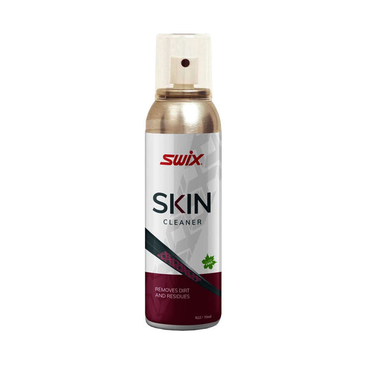 A can of Swix Skin Cleaner spray with a metallic gold upper section, a white label with red and black text, and a dark burgundy lower section, set against a plain white background.